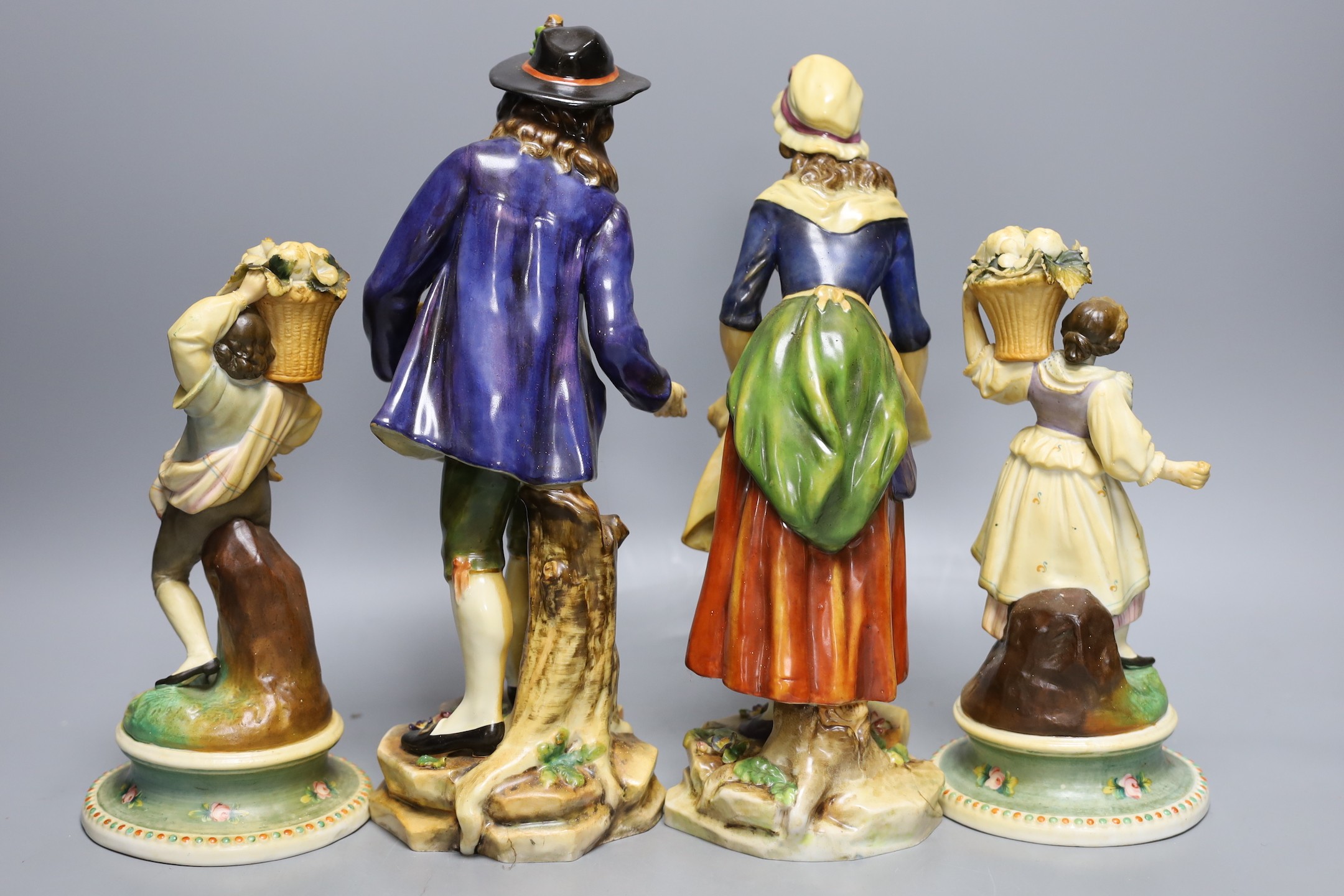 Two pairs of Continental porcelain figures, tallest 30cm